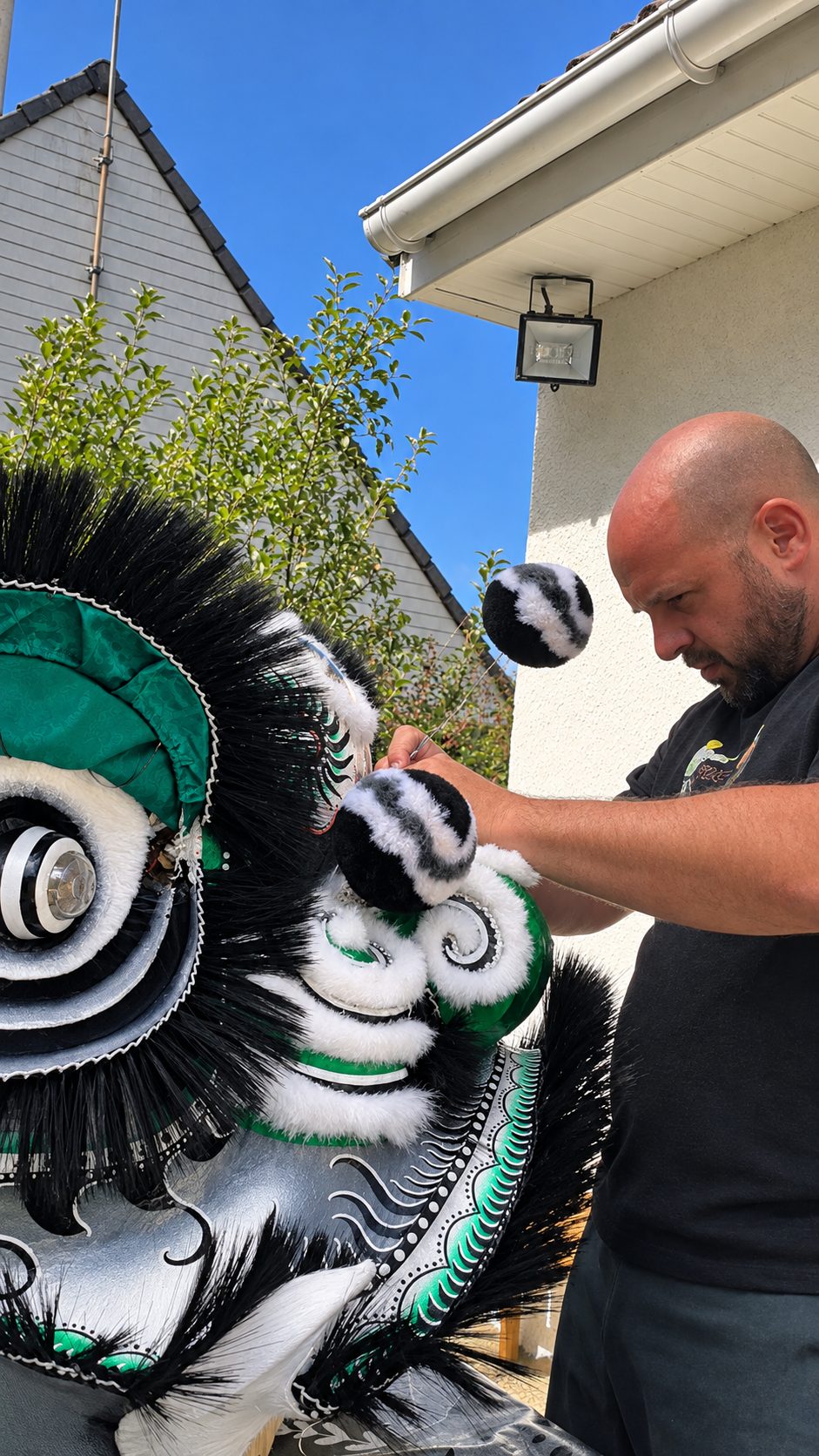 Fitting pompoms and fur on a finished lion head